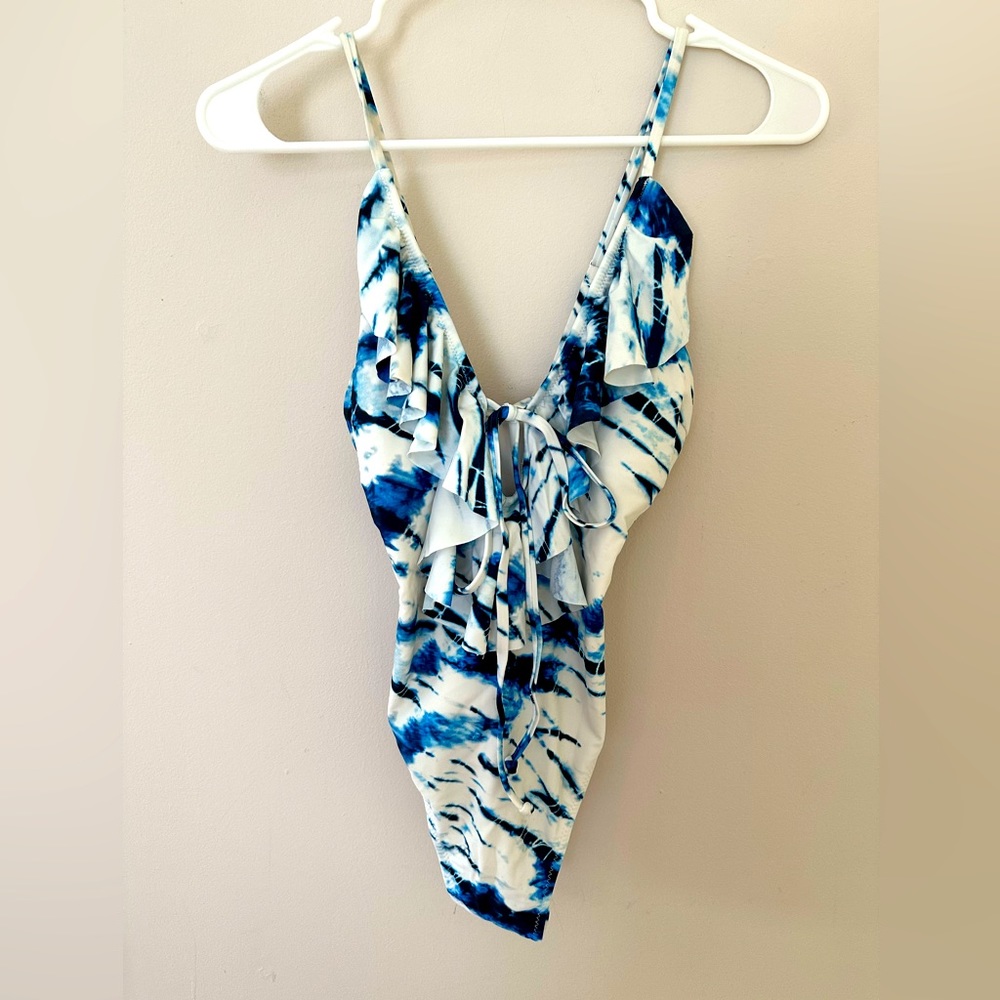 Women’s tie dyed one piece with ruffle details.